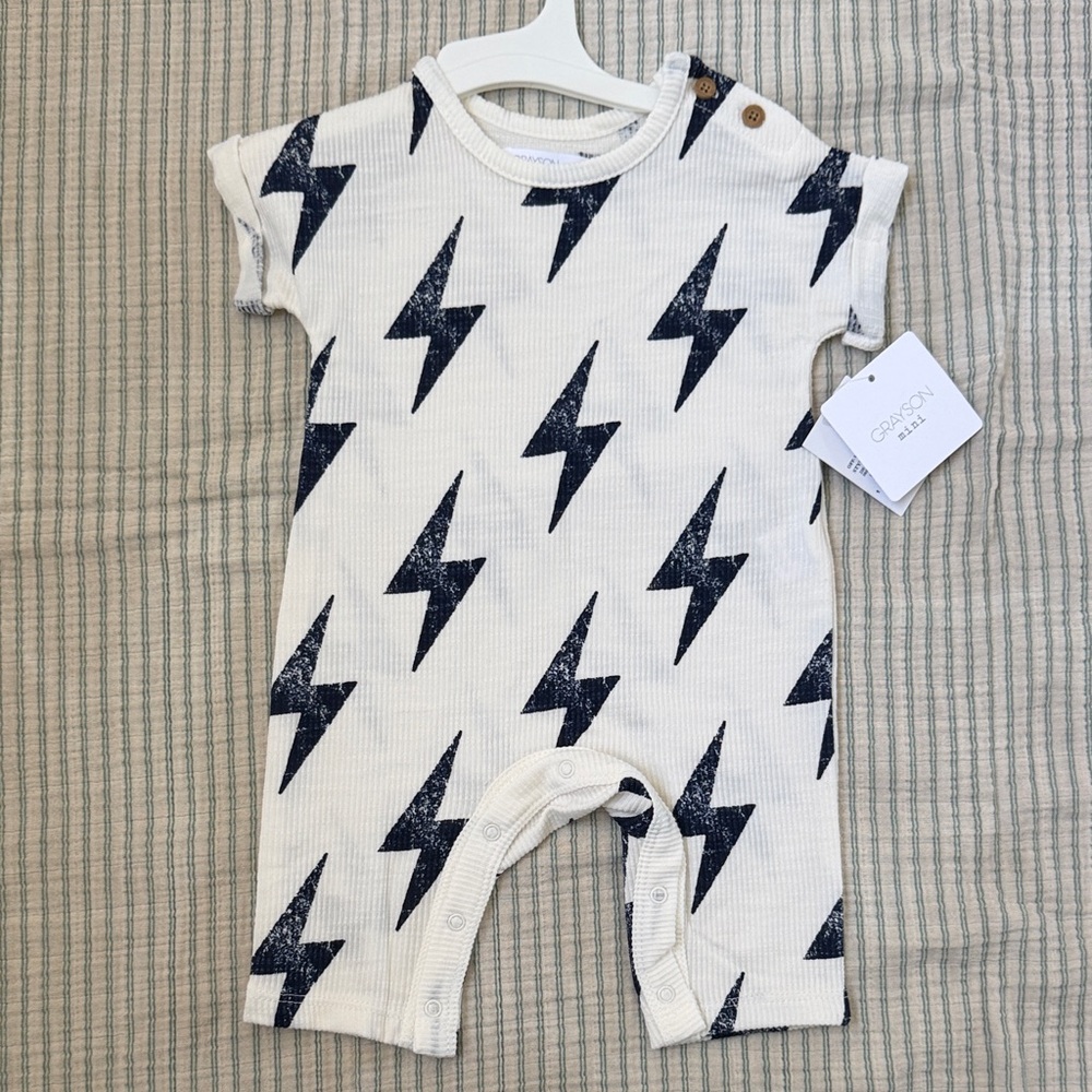 Grayson Mini Cream Baby Romper with Navy Lightning Bolts